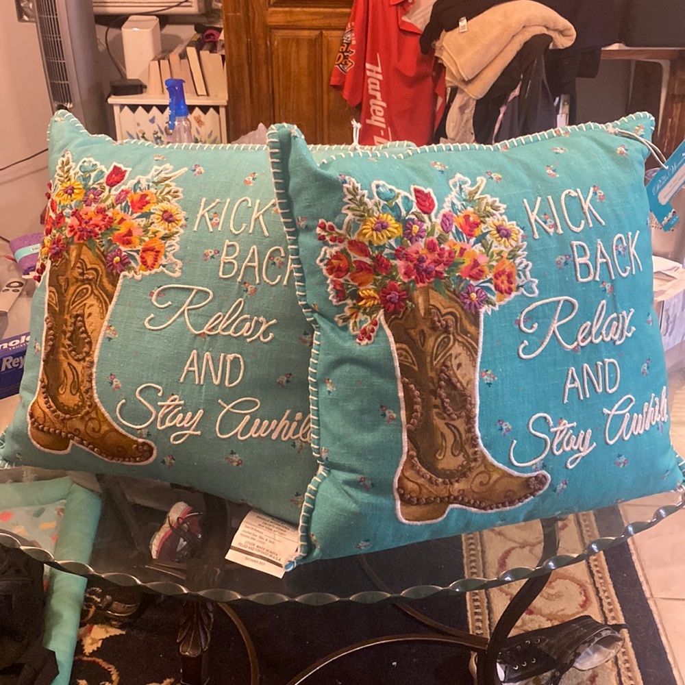 Decorative pair of pioneer woman pillows
